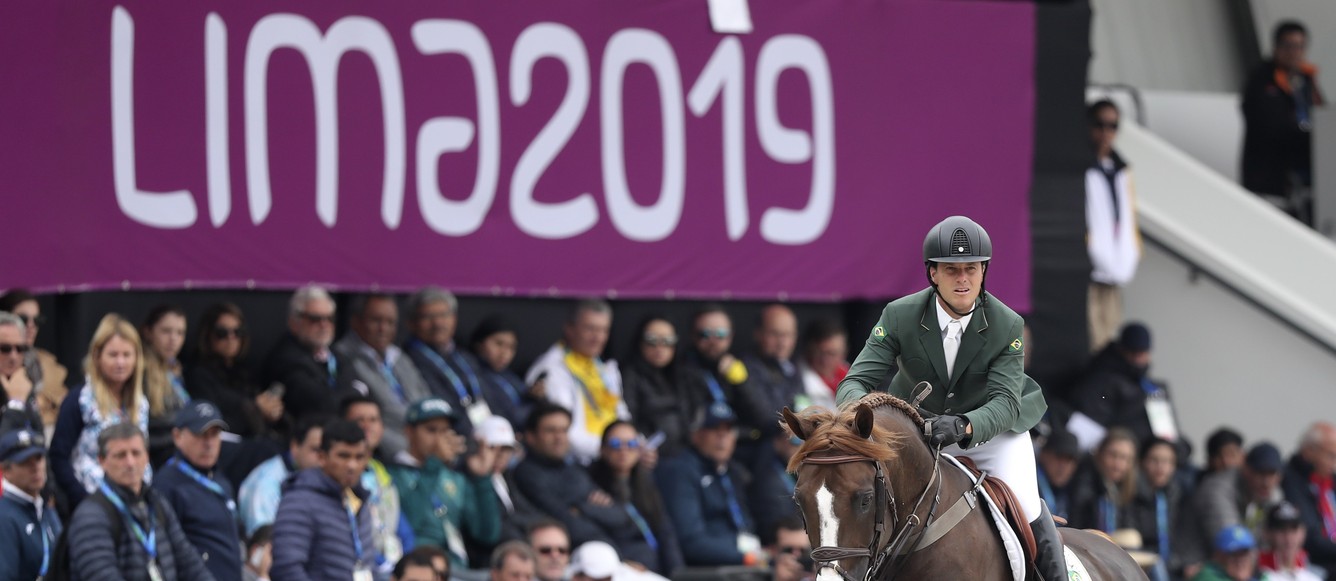 LIMA, PERU - AUGUST 07: Pedro Veniss of Brazil riding Quabri de L Isle competes during equestrian Jumping Team at Army Equestrian School on Day 12 of Lima 2019 Pan American Games on August 7, 2019 in Lima, Peru. (Photo by Raul Sifuentes/Getty Images for FEI)