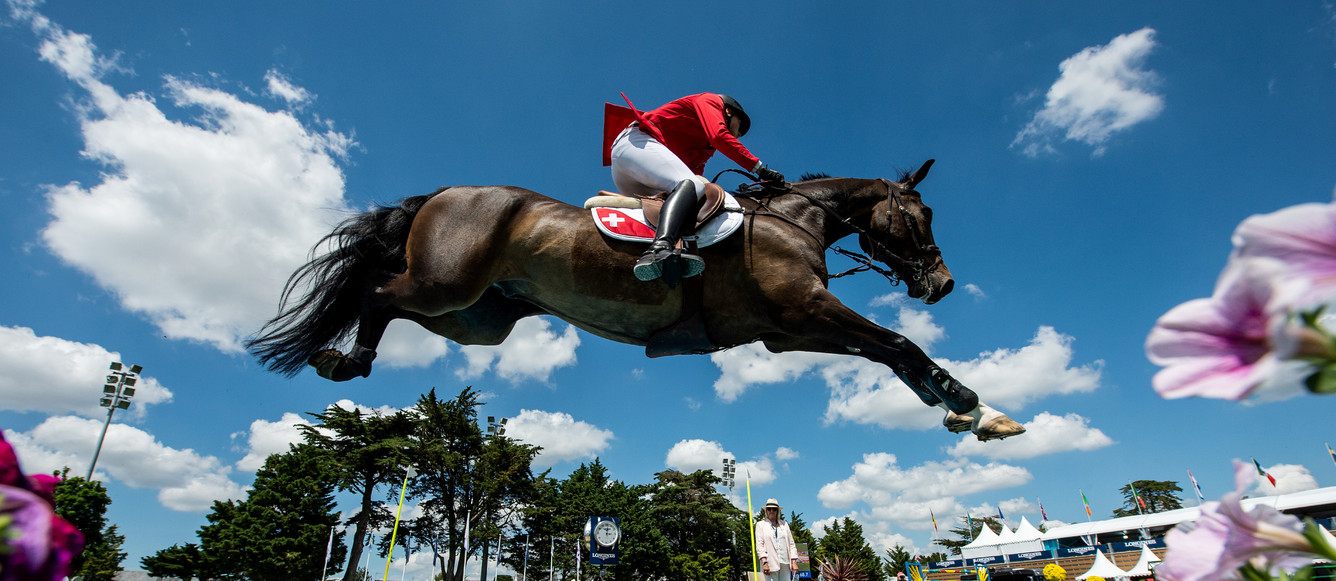 Martin Fuchs of Switzerland on Conner 70 tackles a water jump in the FEI Jumping Nations Cup of France at La Baule, France, June 11, 2021.