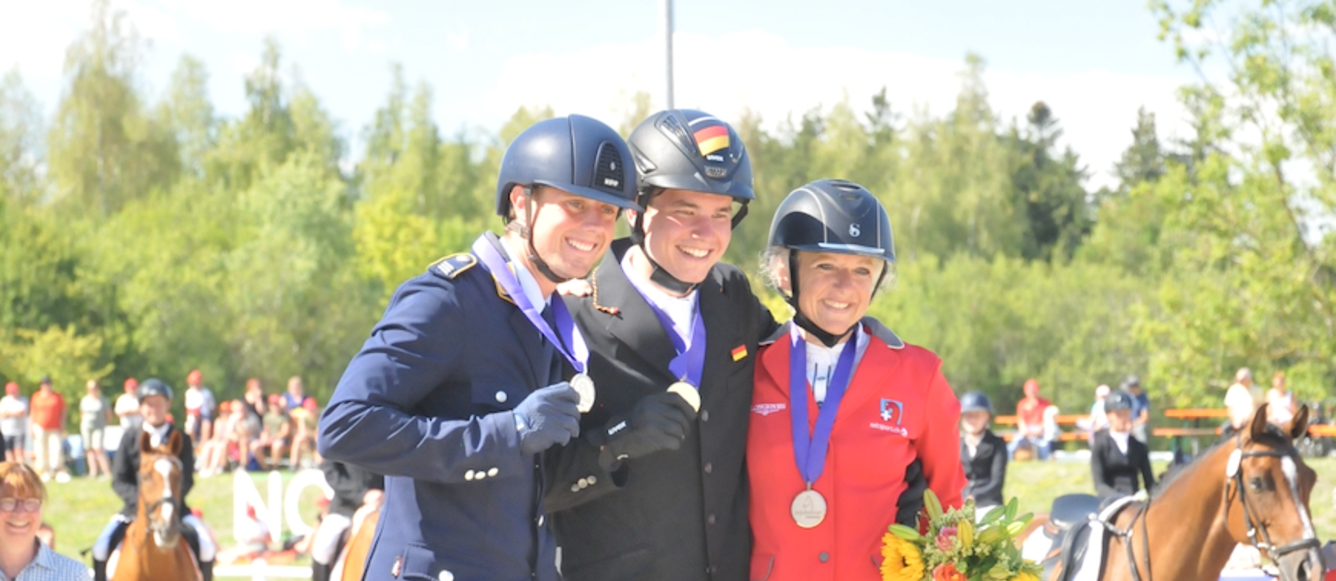 Le podium de l'European Cup 2022 à Equissima® avec en or Nicholas Goldbeck (Chintano 7), en argent Brandon Schäfer-Gehrau (Fräulein Frieda 10) et en bronze Christine Lang (Cooper).  © equissima - Alice de Laromiguiere