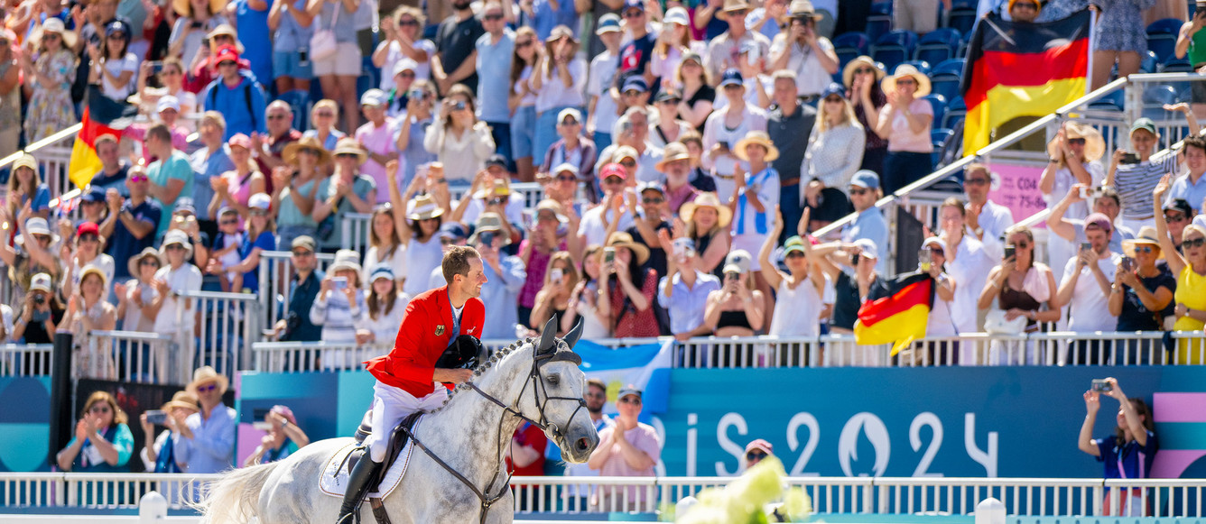Paris 2024 Olympic GamesChristian Kukuk (GER) riding Checker 47 during the Lap of Honour after winning Gold in the Individual Show Jumping Final at the Chateau de Versailles for the Paris 2024 Olympic Games.Photo Credit: FEI/Benjamin Clark