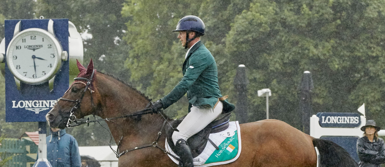 Anthony Codon IRL riding SFS Aristio in the lashings of rain wins the Longines FEI Nations Cup™ of Great Britain for Ireland at Hickstead GBRPhoto FEI/Liz Gregg